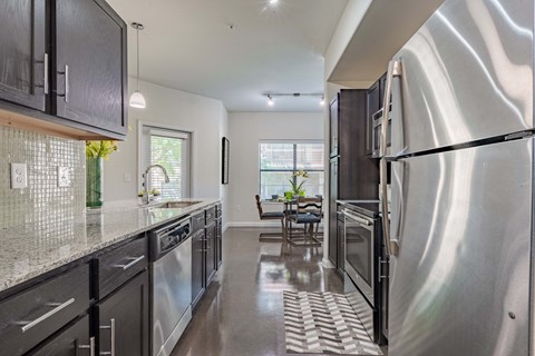Dining Room With Kitchen View at Legacy Brooks, San Antonio, 78223
